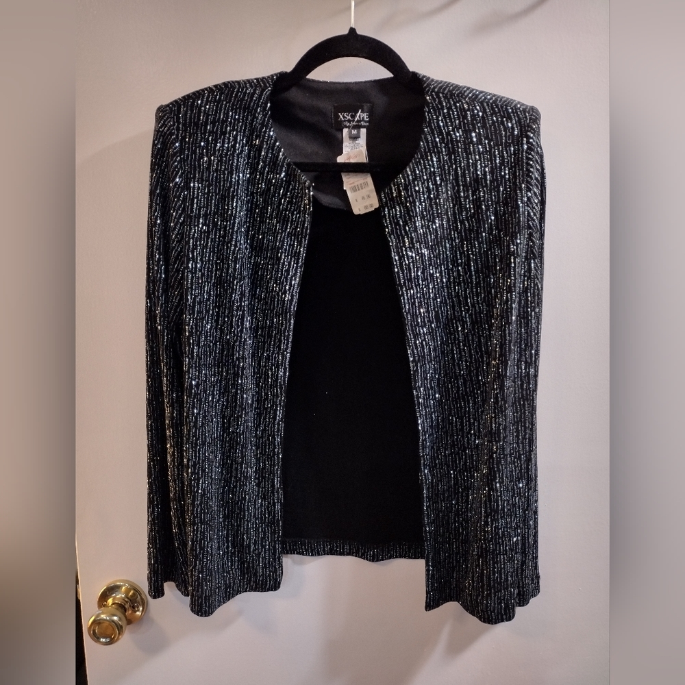 Dress jacket size Medium. Black glitter with a hint of blue